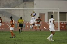 UT freshman Amanda Lisberger (#13, Midfielder) and UT senior Kasey Moore (#14, Defender) watch as UT senior Dianna Pfenninger (#8, Goalkeeper) catches a shot on goal.  The University of Texas women's soccer team tied 0-0 against the Texas A&M Aggies Friday night, September 27, 2008.

Filename: SRM_20080926_1928560.jpg
Aperture: f/4.0
Shutter Speed: 1/500
Body: Canon EOS-1D Mark II
Lens: Canon EF 300mm f/2.8 L IS