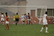 UT freshman Amanda Lisberger (#13, Midfielder) and UT senior Kasey Moore (#14, Defender) watch as UT senior Dianna Pfenninger (#8, Goalkeeper) catches a shot on goal.  The University of Texas women's soccer team tied 0-0 against the Texas A&M Aggies Friday night, September 27, 2008.