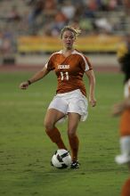 UT sophomore Niki Arlitt (#11, Forward) passes the ball to UT freshman Amanda Lisberger (#13, Midfielder).   The University of Texas women's soccer team tied 0-0 against the Texas A&M Aggies Friday night, September 27, 2008.

Filename: SRM_20080926_1929383.jpg
Aperture: f/4.0
Shutter Speed: 1/400
Body: Canon EOS-1D Mark II
Lens: Canon EF 300mm f/2.8 L IS