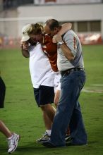 UT freshman Courtney Goodson (#7, Forward and Midfielder) is helped off the field after her injury.  The University of Texas women's soccer team tied 0-0 against the Texas A&M Aggies Friday night, September 27, 2008.

Filename: SRM_20080926_1930161.jpg
Aperture: f/2.8
Shutter Speed: 1/320
Body: Canon EOS 20D
Lens: Canon EF 80-200mm f/2.8 L
