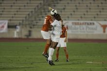 UT sophomore Niki Arlitt (#11, Forward) battles for a header in the air.  The University of Texas women's soccer team tied 0-0 against the Texas A&M Aggies Friday night, September 27, 2008.

Filename: SRM_20080926_1931241.jpg
Aperture: f/4.0
Shutter Speed: 1/500
Body: Canon EOS-1D Mark II
Lens: Canon EF 300mm f/2.8 L IS