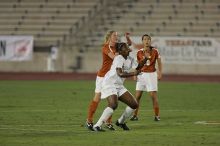 UT sophomore Niki Arlitt (#11, Forward) battles for a header in the air.  The University of Texas women's soccer team tied 0-0 against the Texas A&M Aggies Friday night, September 27, 2008.

Filename: SRM_20080926_1931249.jpg
Aperture: f/4.0
Shutter Speed: 1/400
Body: Canon EOS-1D Mark II
Lens: Canon EF 300mm f/2.8 L IS