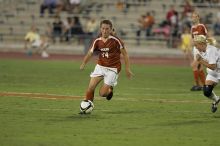 UT senior Kasey Moore (#14, Defender) brings the ball downfield.  The University of Texas women's soccer team tied 0-0 against the Texas A&M Aggies Friday night, September 27, 2008.

Filename: SRM_20080926_1935342.jpg
Aperture: f/4.0
Shutter Speed: 1/400
Body: Canon EOS-1D Mark II
Lens: Canon EF 300mm f/2.8 L IS