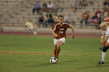 UT senior Kasey Moore (#14, Defender) brings the ball downfield.  The University of Texas women's soccer team tied 0-0 against the Texas A&M Aggies Friday night, September 27, 2008.

Filename: SRM_20080926_1935363.jpg
Aperture: f/4.0
Shutter Speed: 1/400
Body: Canon EOS-1D Mark II
Lens: Canon EF 300mm f/2.8 L IS