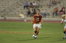 UT senior Kasey Moore (#14, Defender) brings the ball downfield.  The University of Texas women's soccer team tied 0-0 against the Texas A&M Aggies Friday night, September 27, 2008.

Filename: SRM_20080926_1935364.jpg
Aperture: f/4.0
Shutter Speed: 1/400
Body: Canon EOS-1D Mark II
Lens: Canon EF 300mm f/2.8 L IS