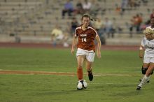 UT senior Kasey Moore (#14, Defender) brings the ball downfield.  The University of Texas women's soccer team tied 0-0 against the Texas A&M Aggies Friday night, September 27, 2008.

Filename: SRM_20080926_1935385.jpg
Aperture: f/4.0
Shutter Speed: 1/400
Body: Canon EOS-1D Mark II
Lens: Canon EF 300mm f/2.8 L IS