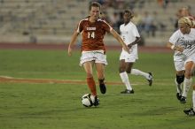 UT senior Kasey Moore (#14, Defender) brings the ball downfield.  The University of Texas women's soccer team tied 0-0 against the Texas A&M Aggies Friday night, September 27, 2008.

Filename: SRM_20080926_1935388.jpg
Aperture: f/4.0
Shutter Speed: 1/400
Body: Canon EOS-1D Mark II
Lens: Canon EF 300mm f/2.8 L IS