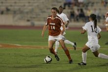 UT senior Kasey Moore (#14, Defender) brings the ball downfield.  The University of Texas women's soccer team tied 0-0 against the Texas A&M Aggies Friday night, September 27, 2008.

Filename: SRM_20080926_1935400.jpg
Aperture: f/4.0
Shutter Speed: 1/500
Body: Canon EOS-1D Mark II
Lens: Canon EF 300mm f/2.8 L IS