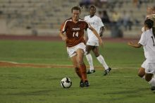 UT senior Kasey Moore (#14, Defender) brings the ball downfield.  The University of Texas women's soccer team tied 0-0 against the Texas A&M Aggies Friday night, September 27, 2008.

Filename: SRM_20080926_1935409.jpg
Aperture: f/4.0
Shutter Speed: 1/500
Body: Canon EOS-1D Mark II
Lens: Canon EF 300mm f/2.8 L IS