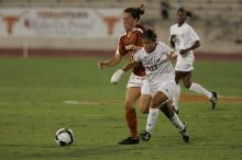UT senior Kasey Moore (#14, Defender) brings the ball downfield.  The University of Texas women's soccer team tied 0-0 against the Texas A&M Aggies Friday night, September 27, 2008.

Filename: SRM_20080926_1935425.jpg
Aperture: f/4.0
Shutter Speed: 1/500
Body: Canon EOS-1D Mark II
Lens: Canon EF 300mm f/2.8 L IS
