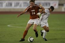 UT senior Kasey Moore (#14, Defender) brings the ball downfield.  The University of Texas women's soccer team tied 0-0 against the Texas A&M Aggies Friday night, September 27, 2008.

Filename: SRM_20080926_1935442.jpg
Aperture: f/4.0
Shutter Speed: 1/500
Body: Canon EOS-1D Mark II
Lens: Canon EF 300mm f/2.8 L IS