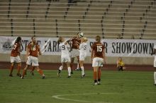 UT senior Stephanie Logterman (#10, Defender) heads the ball as UT freshman Kylie Doniak (#15, Midfielder), UT freshman Lucy Keith (#6, Midfielder), UT senior Courtney Gaines (#23, Midfielder) watch.  The University of Texas women's soccer team tied 0-0 against the Texas A&M Aggies Friday night, September 27, 2008.

Filename: SRM_20080926_1940026.jpg
Aperture: f/4.0
Shutter Speed: 1/500
Body: Canon EOS-1D Mark II
Lens: Canon EF 300mm f/2.8 L IS