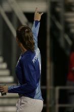 UT senior Dianna Pfenninger (#8, Goalkeeper) gives a Hook'em to the fans as they leave the field at the end of the first half.  The University of Texas women's soccer team tied 0-0 against the Texas A&M Aggies Friday night, September 27, 2008.

Filename: SRM_20080926_1948166.jpg
Aperture: f/2.8
Shutter Speed: 1/500
Body: Canon EOS-1D Mark II
Lens: Canon EF 300mm f/2.8 L IS