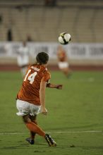 UT senior Kasey Moore (#14, Defender) sends the ball downfield.  The University of Texas women's soccer team tied 0-0 against the Texas A&M Aggies Friday night, September 27, 2008.

Filename: SRM_20080926_2005448.jpg
Aperture: f/2.8
Shutter Speed: 1/500
Body: Canon EOS-1D Mark II
Lens: Canon EF 300mm f/2.8 L IS