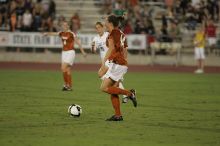 UT senior Kasey Moore (#14, Defender).  The University of Texas women's soccer team tied 0-0 against the Texas A&M Aggies Friday night, September 27, 2008.

Filename: SRM_20080926_2012127.jpg
Aperture: f/2.8
Shutter Speed: 1/500
Body: Canon EOS-1D Mark II
Lens: Canon EF 300mm f/2.8 L IS