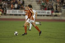 UT senior Kasey Moore (#14, Defender).  The University of Texas women's soccer team tied 0-0 against the Texas A&M Aggies Friday night, September 27, 2008.

Filename: SRM_20080926_2012128.jpg
Aperture: f/2.8
Shutter Speed: 1/500
Body: Canon EOS-1D Mark II
Lens: Canon EF 300mm f/2.8 L IS