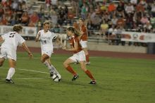 UT senior Jill Gilbeau (#4, Defender and Midfielder).  The University of Texas women's soccer team tied 0-0 against the Texas A&M Aggies Friday night, September 27, 2008.

Filename: SRM_20080926_2019584.jpg
Aperture: f/4.0
Shutter Speed: 1/400
Body: Canon EOS-1D Mark II
Lens: Canon EF 300mm f/2.8 L IS