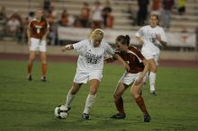 UT junior Emily Anderson (#21, Forward) plays defense on A&M #33.  The University of Texas women's soccer team tied 0-0 against the Texas A&M Aggies Friday night, September 27, 2008.

Filename: SRM_20080926_2027408.jpg
Aperture: f/2.8
Shutter Speed: 1/640
Body: Canon EOS-1D Mark II
Lens: Canon EF 300mm f/2.8 L IS