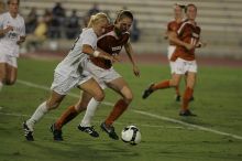 UT junior Emily Anderson (#21, Forward) plays defense on A&M #33.  The University of Texas women's soccer team tied 0-0 against the Texas A&M Aggies Friday night, September 27, 2008.

Filename: SRM_20080926_2027425.jpg
Aperture: f/2.8
Shutter Speed: 1/640
Body: Canon EOS-1D Mark II
Lens: Canon EF 300mm f/2.8 L IS