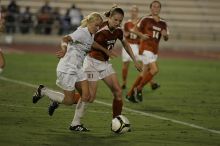 UT junior Emily Anderson (#21, Forward) plays defense on A&M #33.  The University of Texas women's soccer team tied 0-0 against the Texas A&M Aggies Friday night, September 27, 2008.

Filename: SRM_20080926_2027446.jpg
Aperture: f/2.8
Shutter Speed: 1/640
Body: Canon EOS-1D Mark II
Lens: Canon EF 300mm f/2.8 L IS