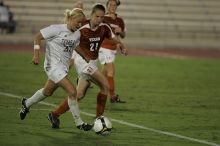 UT junior Emily Anderson (#21, Forward) plays defense on A&M #33.  The University of Texas women's soccer team tied 0-0 against the Texas A&M Aggies Friday night, September 27, 2008.

Filename: SRM_20080926_2027447.jpg
Aperture: f/2.8
Shutter Speed: 1/640
Body: Canon EOS-1D Mark II
Lens: Canon EF 300mm f/2.8 L IS