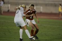 UT junior Emily Anderson (#21, Forward) plays defense on A&M #33.  The University of Texas women's soccer team tied 0-0 against the Texas A&M Aggies Friday night, September 27, 2008.

Filename: SRM_20080926_2027461.jpg
Aperture: f/2.8
Shutter Speed: 1/640
Body: Canon EOS-1D Mark II
Lens: Canon EF 300mm f/2.8 L IS