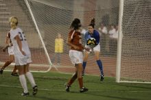 UT senior Dianna Pfenninger (#8, Goalkeeper) catches a shot on goal as UT senior Stephanie Logterman (#10, Defender) watches.  The University of Texas women's soccer team tied 0-0 against the Texas A&M Aggies Friday night, September 27, 2008.

Filename: SRM_20080926_2029168.jpg
Aperture: f/2.8
Shutter Speed: 1/640
Body: Canon EOS-1D Mark II
Lens: Canon EF 300mm f/2.8 L IS