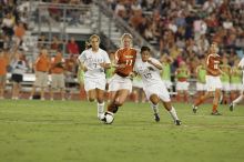 UT sophomore Niki Arlitt (#11, Forward) battles for the ball.  The University of Texas women's soccer team tied 0-0 against the Texas A&M Aggies Friday night, September 27, 2008.

Filename: SRM_20080926_2036546.jpg
Aperture: f/4.0
Shutter Speed: 1/200
Body: Canon EOS-1D Mark II
Lens: Canon EF 300mm f/2.8 L IS