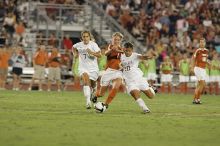 UT sophomore Niki Arlitt (#11, Forward) battles for the ball.  The University of Texas women's soccer team tied 0-0 against the Texas A&M Aggies Friday night, September 27, 2008.

Filename: SRM_20080926_2036567.jpg
Aperture: f/4.0
Shutter Speed: 1/200
Body: Canon EOS-1D Mark II
Lens: Canon EF 300mm f/2.8 L IS