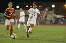 UT sophomore Alisha Ortiz (#12, Forward) takes the ball down the field.  The University of Texas women's soccer team tied 0-0 against the Texas A&M Aggies Friday night, September 27, 2008.

Filename: SRM_20080926_2041184.jpg
Aperture: f/4.0
Shutter Speed: 1/200
Body: Canon EOS-1D Mark II
Lens: Canon EF 300mm f/2.8 L IS