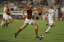 UT freshman Courtney Goodson (#7, Forward and Midfielder) takes the ball down the field.  The University of Texas women's soccer team tied 0-0 against the Texas A&M Aggies Friday night, September 27, 2008.

Filename: SRM_20080926_2048301.jpg
Aperture: f/2.8
Shutter Speed: 1/500
Body: Canon EOS-1D Mark II
Lens: Canon EF 300mm f/2.8 L IS