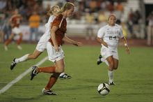 UT freshman Courtney Goodson (#7, Forward and Midfielder) takes the ball down the field.  The University of Texas women's soccer team tied 0-0 against the Texas A&M Aggies Friday night, September 27, 2008.

Filename: SRM_20080926_2048325.jpg
Aperture: f/2.8
Shutter Speed: 1/500
Body: Canon EOS-1D Mark II
Lens: Canon EF 300mm f/2.8 L IS