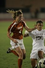 UT senior Jill Gilbeau (#4, Defender and Midfielder).  The University of Texas women's soccer team tied 0-0 against the Texas A&M Aggies Friday night, September 27, 2008.

Filename: SRM_20080926_2049080.jpg
Aperture: f/2.8
Shutter Speed: 1/500
Body: Canon EOS-1D Mark II
Lens: Canon EF 300mm f/2.8 L IS