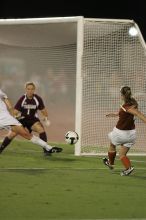 UT senior Jill Gilbeau (#4, Defender and Midfielder) takes a shot on goal.  The University of Texas women's soccer team tied 0-0 against the Texas A&M Aggies Friday night, September 27, 2008.

Filename: SRM_20080926_2049162.jpg
Aperture: f/2.8
Shutter Speed: 1/500
Body: Canon EOS-1D Mark II
Lens: Canon EF 300mm f/2.8 L IS