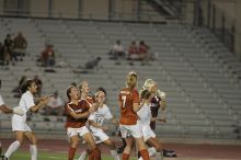 A&M goalkeeper catches another shot on goal as UT senior Kasey Moore (#14, Defender) and UT freshman Lucy Keith (#6, Midfielder) attempt the header and UT freshman Courtney Goodson (#7, Forward and Midfielder) watches.  The University of Texas women's soccer team tied 0-0 against the Texas A&M Aggies Friday night, September 27, 2008.

Filename: SRM_20080926_2049487.jpg
Aperture: f/2.8
Shutter Speed: 1/500
Body: Canon EOS-1D Mark II
Lens: Canon EF 300mm f/2.8 L IS