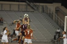 A&M goalkeeper catches another shot on goal as UT senior Kasey Moore (#14, Defender) and UT freshman Lucy Keith (#6, Midfielder) attempt the header and UT freshman Courtney Goodson (#7, Forward and Midfielder) watches.  The University of Texas women's soccer team tied 0-0 against the Texas A&M Aggies Friday night, September 27, 2008.

Filename: SRM_20080926_2049489.jpg
Aperture: f/2.8
Shutter Speed: 1/500
Body: Canon EOS-1D Mark II
Lens: Canon EF 300mm f/2.8 L IS