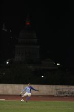 UT senior Dianna Pfenninger (#8, Goalkeeper) takes a goal kick with the capitol in the background.  The University of Texas women's soccer team tied 0-0 against the Texas A&M Aggies Friday night, September 27, 2008.

Filename: SRM_20080926_2050188.jpg
Aperture: f/2.8
Shutter Speed: 1/500
Body: Canon EOS-1D Mark II
Lens: Canon EF 300mm f/2.8 L IS