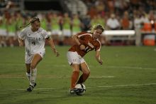 UT sophomore Niki Arlitt (#11, Forward) steals the ball from an Aggie.  The University of Texas women's soccer team tied 0-0 against the Texas A&M Aggies Friday night, September 27, 2008.

Filename: SRM_20080926_2056088.jpg
Aperture: f/2.8
Shutter Speed: 1/640
Body: Canon EOS-1D Mark II
Lens: Canon EF 300mm f/2.8 L IS