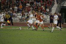 UT freshman Courtney Goodson (#7, Forward and Midfielder) tries to steal the ball as UT sophomore Niki Arlitt (#11, Forward) watches.  The University of Texas women's soccer team tied 0-0 against the Texas A&M Aggies Friday night, September 27, 2008.

Filename: SRM_20080926_2056505.jpg
Aperture: f/2.8
Shutter Speed: 1/640
Body: Canon EOS-1D Mark II
Lens: Canon EF 300mm f/2.8 L IS