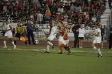 UT freshman Courtney Goodson (#7, Forward and Midfielder) tries to steal the ball as UT sophomore Niki Arlitt (#11, Forward) watches.  The University of Texas women's soccer team tied 0-0 against the Texas A&M Aggies Friday night, September 27, 2008.

Filename: SRM_20080926_2056526.jpg
Aperture: f/2.8
Shutter Speed: 1/640
Body: Canon EOS-1D Mark II
Lens: Canon EF 300mm f/2.8 L IS