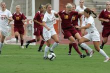 UT sophomore Niki Arlitt (#11, Forward) passes the ball to UT sophomore Alisha Ortiz (#12, Forward).  The University of Texas women's soccer team won 2-1 against the Iowa State Cyclones Sunday afternoon, October 5, 2008.

Filename: SRM_20081005_11594491.jpg
Aperture: f/8.0
Shutter Speed: 1/800
Body: Canon EOS-1D Mark II
Lens: Canon EF 300mm f/2.8 L IS