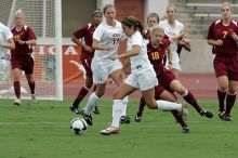 UT sophomore Niki Arlitt (#11, Forward) passes the ball to UT sophomore Alisha Ortiz (#12, Forward).  The University of Texas women's soccer team won 2-1 against the Iowa State Cyclones Sunday afternoon, October 5, 2008.

Filename: SRM_20081005_11594492.jpg
Aperture: f/8.0
Shutter Speed: 1/800
Body: Canon EOS-1D Mark II
Lens: Canon EF 300mm f/2.8 L IS