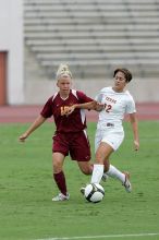 UT sophomore Alisha Ortiz (#12, Forward) fights for the ball.  The University of Texas women's soccer team won 2-1 against the Iowa State Cyclones Sunday afternoon, October 5, 2008.

Filename: SRM_20081005_12042235.jpg
Aperture: f/5.6
Shutter Speed: 1/1250
Body: Canon EOS-1D Mark II
Lens: Canon EF 300mm f/2.8 L IS