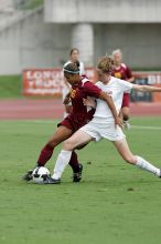 UT junior Emily Anderson (#21, Forward) stabs at the ball.  The University of Texas women's soccer team won 2-1 against the Iowa State Cyclones Sunday afternoon, October 5, 2008.

Filename: SRM_20081005_12051647.jpg
Aperture: f/5.6
Shutter Speed: 1/1250
Body: Canon EOS-1D Mark II
Lens: Canon EF 300mm f/2.8 L IS