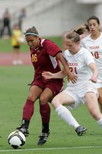 UT senior Stephanie Logterman (#10, Defender) and UT junior Emily Anderson (#21, Forward) team up on Iowa State #16.  The University of Texas women's soccer team won 2-1 against the Iowa State Cyclones Sunday afternoon, October 5, 2008.

Filename: SRM_20081005_12052263.jpg
Aperture: f/5.6
Shutter Speed: 1/1250
Body: Canon EOS-1D Mark II
Lens: Canon EF 300mm f/2.8 L IS