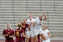 UT freshman Lucy Keith (#6, Midfielder) and UT freshman Courtney Goodson (#7, Forward and Midfielder) fight for the header as UT senior Kasey Moore (#14, Defender) watches.  Keith makes contact, which was an assist to UT junior Emily Anderson (#21, Forward).  The University of Texas women's soccer team won 2-1 against the Iowa State Cyclones Sunday afternoon, October 5, 2008.

Filename: SRM_20081005_12210084.jpg
Aperture: f/5.0
Shutter Speed: 1/1250
Body: Canon EOS-1D Mark II
Lens: Canon EF 300mm f/2.8 L IS