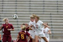 UT freshman Lucy Keith (#6, Midfielder) and UT freshman Courtney Goodson (#7, Forward and Midfielder) fight for the header as UT senior Kasey Moore (#14, Defender) watches.  Keith makes contact, which was an assist to UT junior Emily Anderson (#21, Forward).  The University of Texas women's soccer team won 2-1 against the Iowa State Cyclones Sunday afternoon, October 5, 2008.

Filename: SRM_20081005_12210086.jpg
Aperture: f/5.0
Shutter Speed: 1/1600
Body: Canon EOS-1D Mark II
Lens: Canon EF 300mm f/2.8 L IS