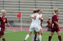 UT freshman Courtney Goodson (#7, Forward and Midfielder) congratulates UT junior Emily Anderson (#21, Forward) after her goal in the first half.  The University of Texas women's soccer team won 2-1 against the Iowa State Cyclones Sunday afternoon, October 5, 2008.

Filename: SRM_20081005_12210490.jpg
Aperture: f/5.0
Shutter Speed: 1/2000
Body: Canon EOS-1D Mark II
Lens: Canon EF 300mm f/2.8 L IS