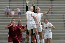 UT junior Emily Anderson (#21, Forward) and UT freshman Lucy Keith (#6, Midfielder) fight for the header with the keeper, as UT junior Stephanie Gibson (#22, Defense and Forward) watches.  The University of Texas women's soccer team won 2-1 against the Iowa State Cyclones Sunday afternoon, October 5, 2008.

Filename: SRM_20081005_12420421.jpg
Aperture: f/5.6
Shutter Speed: 1/2000
Body: Canon EOS-1D Mark II
Lens: Canon EF 300mm f/2.8 L IS