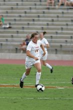 UT senior Kasey Moore (#14, Defender) takes the ball upfield in the second half.  The University of Texas women's soccer team won 2-1 against the Iowa State Cyclones Sunday afternoon, October 5, 2008.

Filename: SRM_20081005_13175060.jpg
Aperture: f/5.6
Shutter Speed: 1/1250
Body: Canon EOS-1D Mark II
Lens: Canon EF 300mm f/2.8 L IS